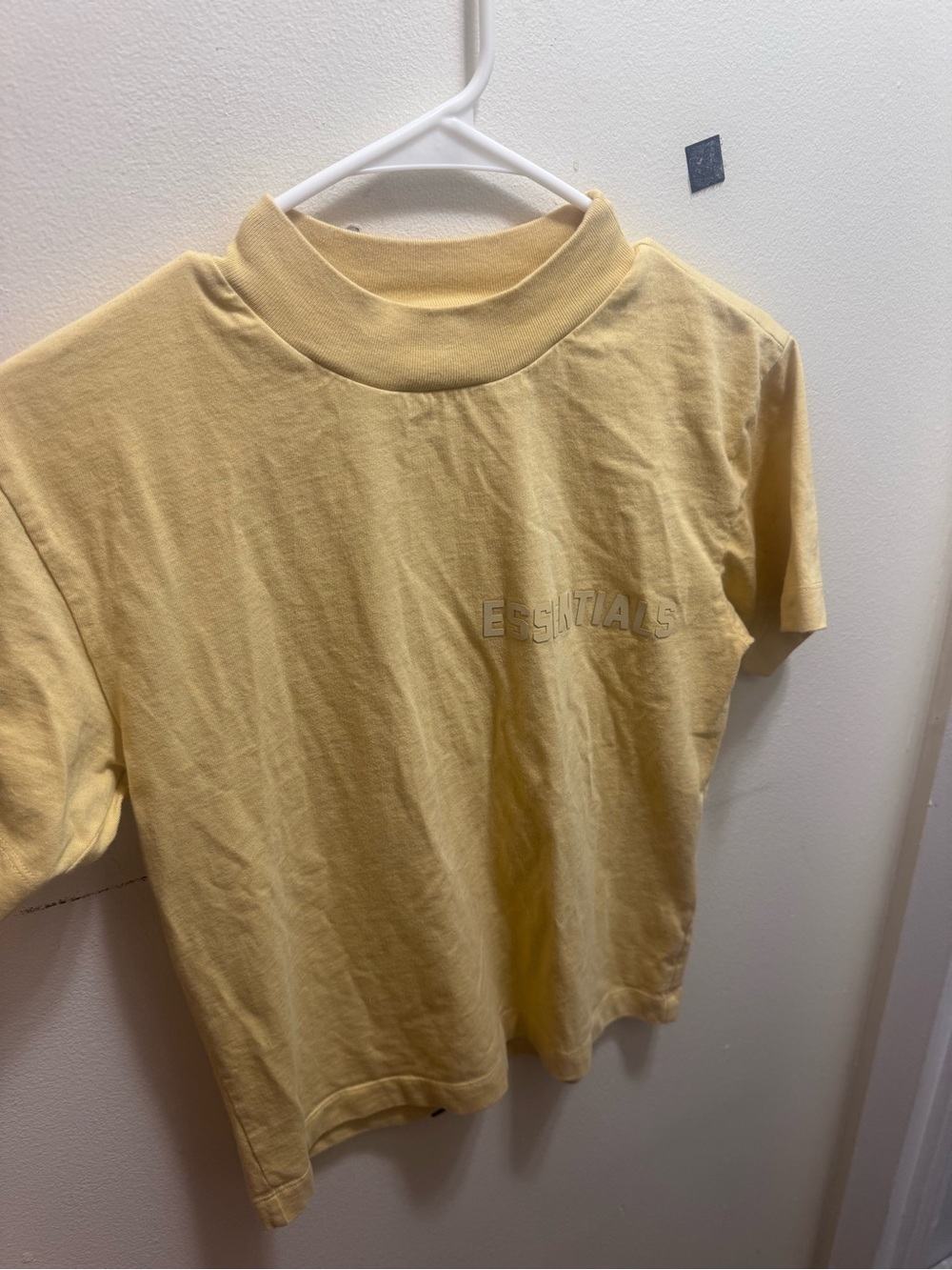 ESSENTIALS Pale Yellow Mock Neck Tee with Embossed Logo size XS